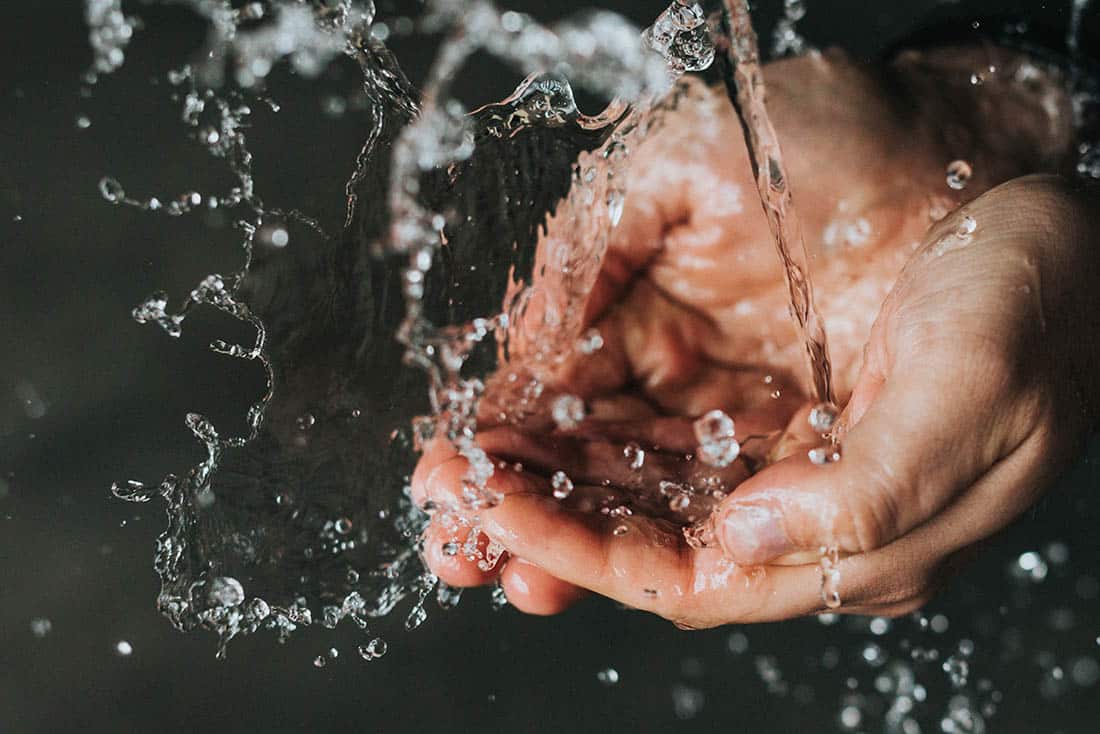 Two hands gathering clean water